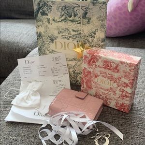 Christian Dior pink wallet.